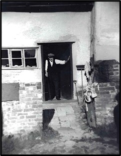 Henry Harry Cox outside Oak Farm